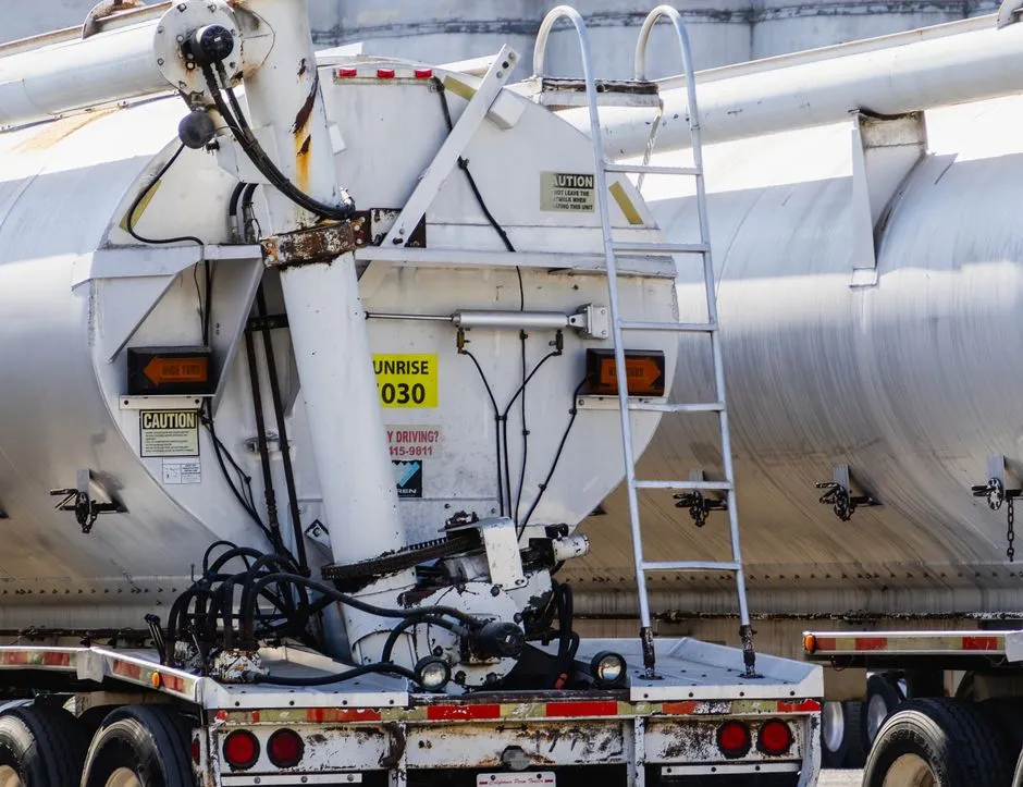 Tanker truck on a highway, a type of vehicle commonly used to transport placarded hazardous materials